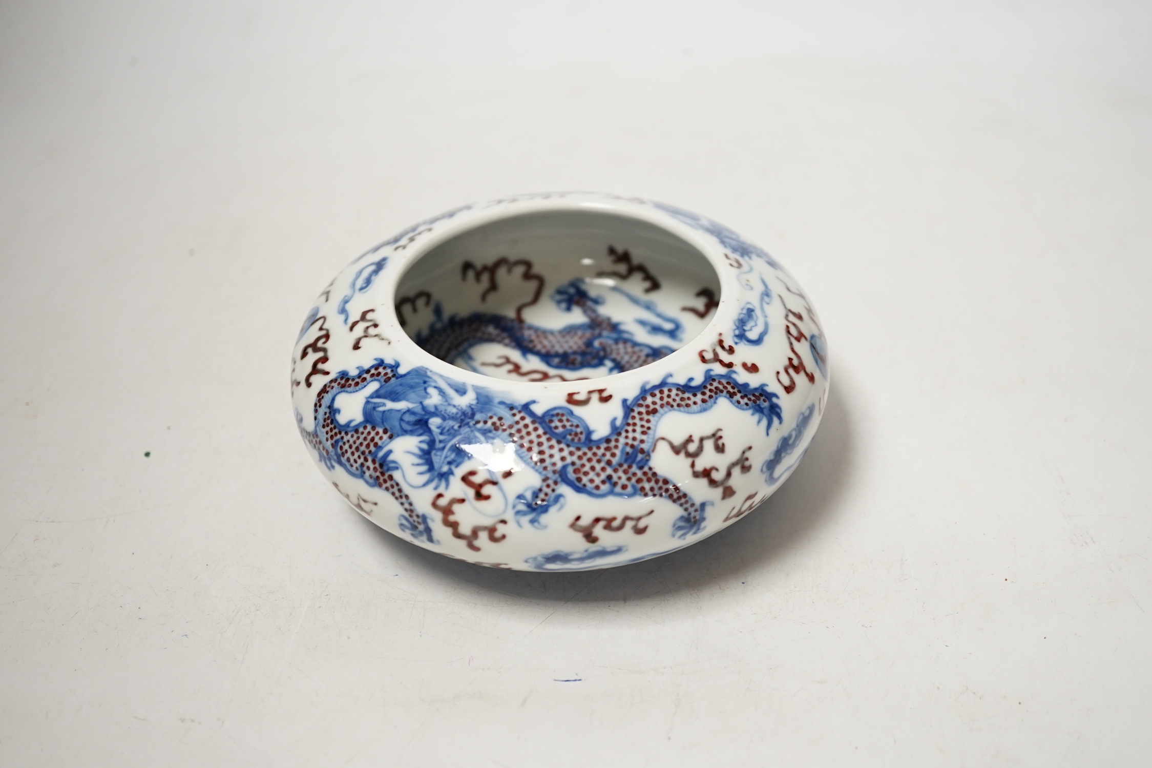 A Chinese underglaze blue and copper red ‘Dragon’ brushwasher, Guangxu period, 15cm diameter